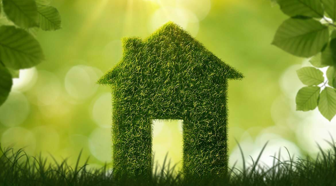 Maison verte symbolisant l'innovation durable en technologie.