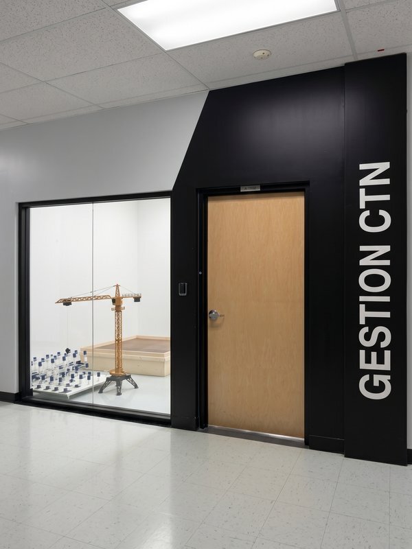 A modern workspace featuring construction models, robotics, and technology for advanced engineering studies.