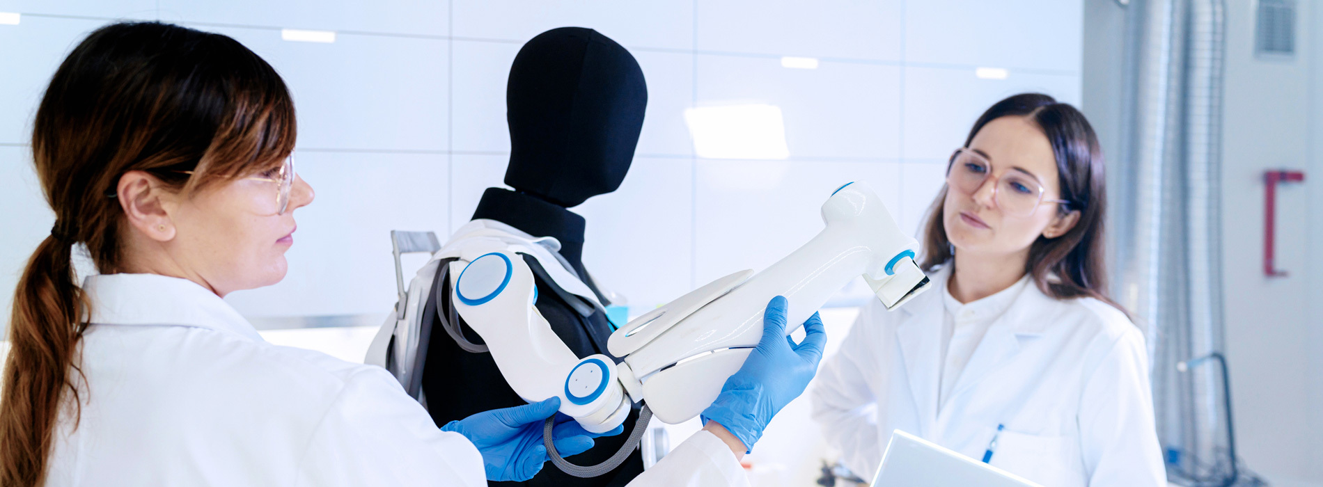 Researchers collaborate on robotic technology, focusing on the design and functionality of advanced robotic arms for various applications.