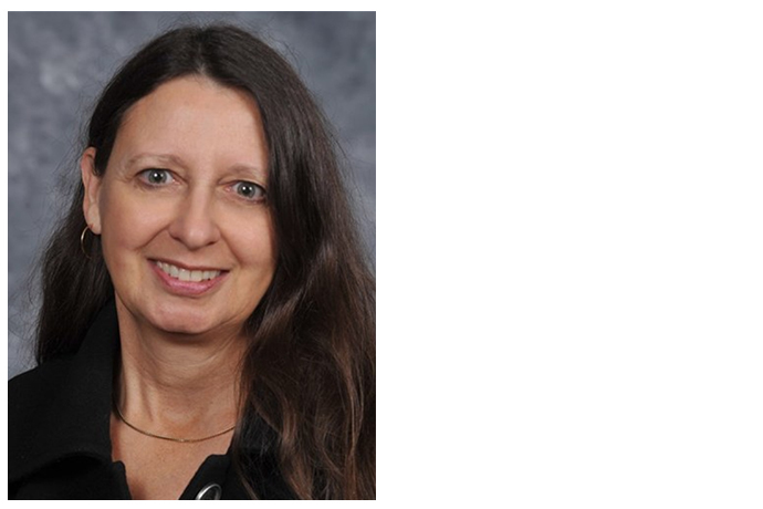 Professional portrait of a faculty member with a friendly demeanor, dressed in business attire.
