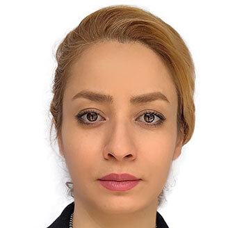 Faculty member in technology with a focused, professional look.