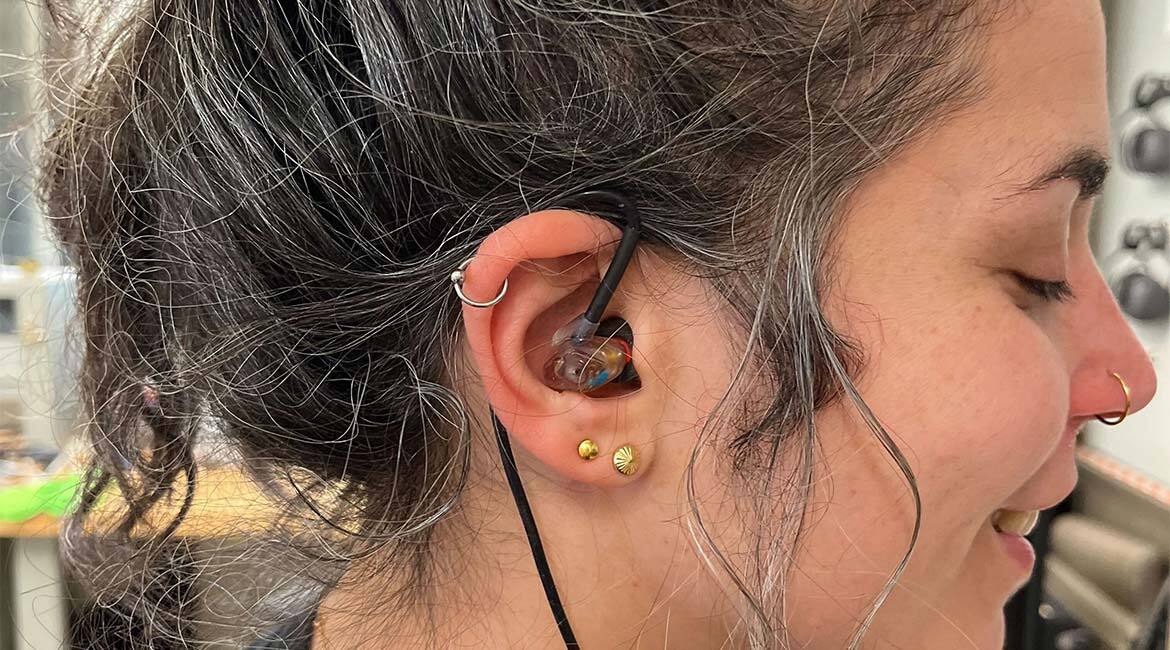 Rachel Bouserhal wearing an advanced in-ear device