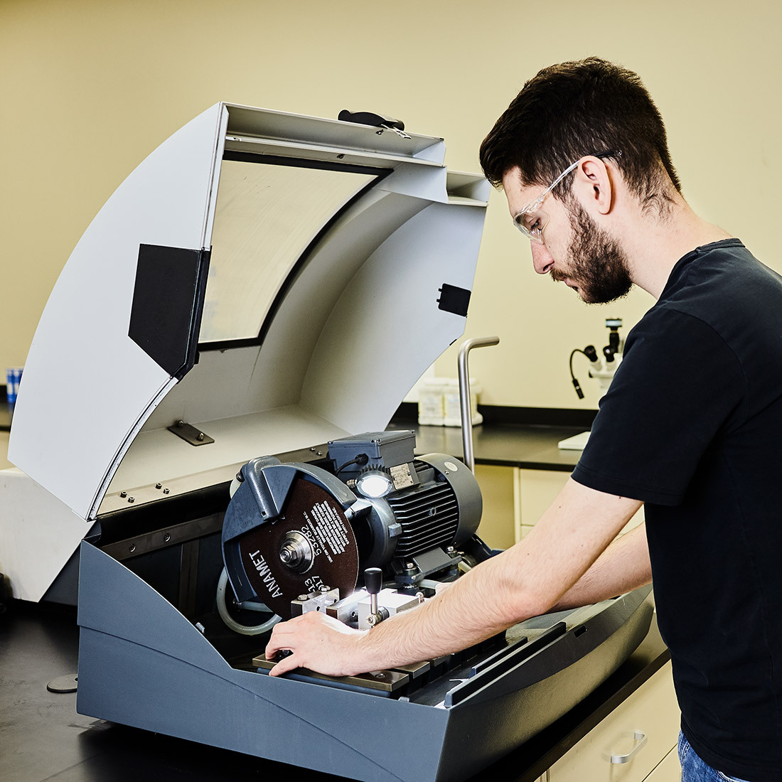 Student conducts research using advanced lab equipment.