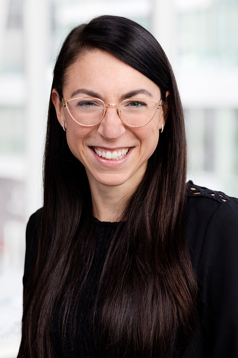 Confident professional in tech education with a welcoming smile.