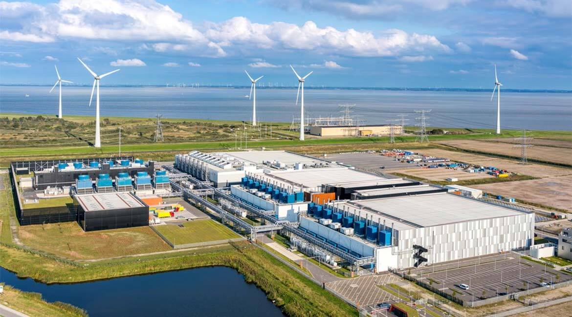 Centre de technologie avec éoliennes, symbolisant l'innovation et l'énergie durable.