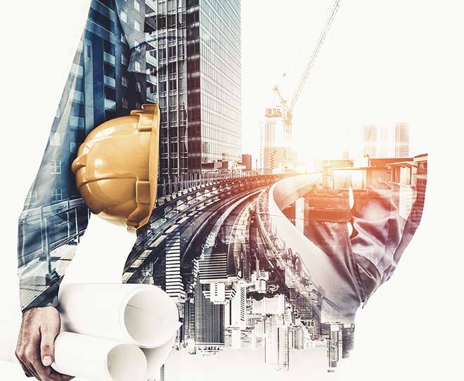 Engineering vision with hardhat and blueprints over cityscape.