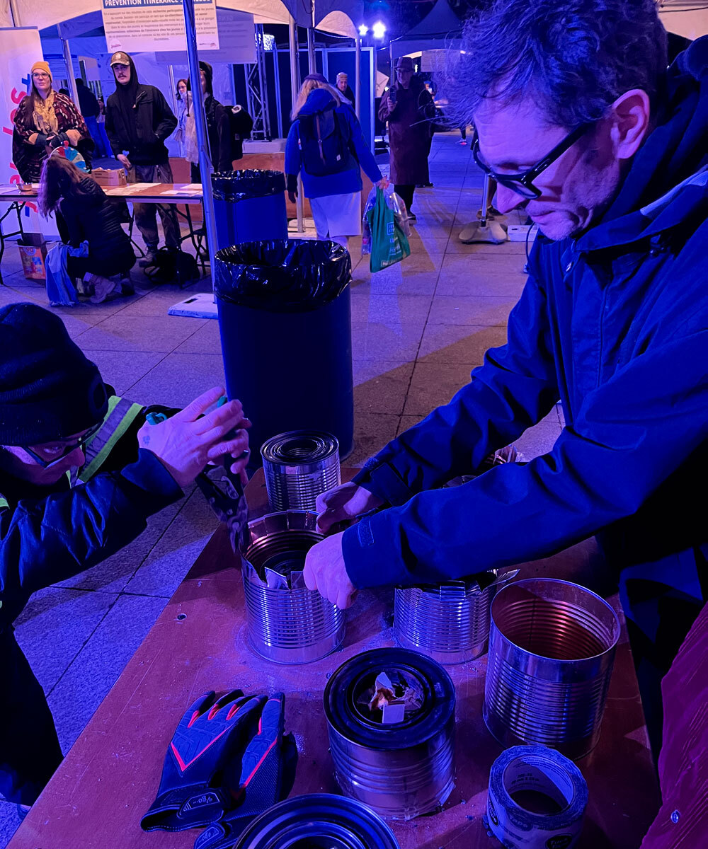 Students gathered around a low-tech oven during an evening workshop.