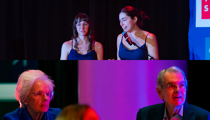 Des étudiantes prennent la parole lors d'un événement, tandis qu'un public attentif écoute, capturant l'atmosphère d'engagement.