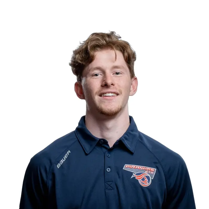 Étudiant souriant en maillot de sport avec logo de l'ÉTS.