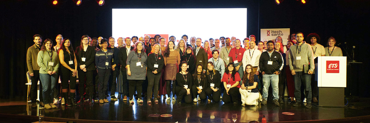 A diverse group of individuals gathers on stage for a conference at a technology university, showcasing collaboration and innovation.