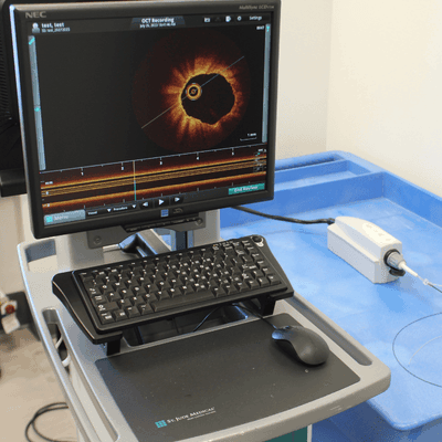 A high-tech workstation featuring an OCT imaging system for advanced technological research and analysis.