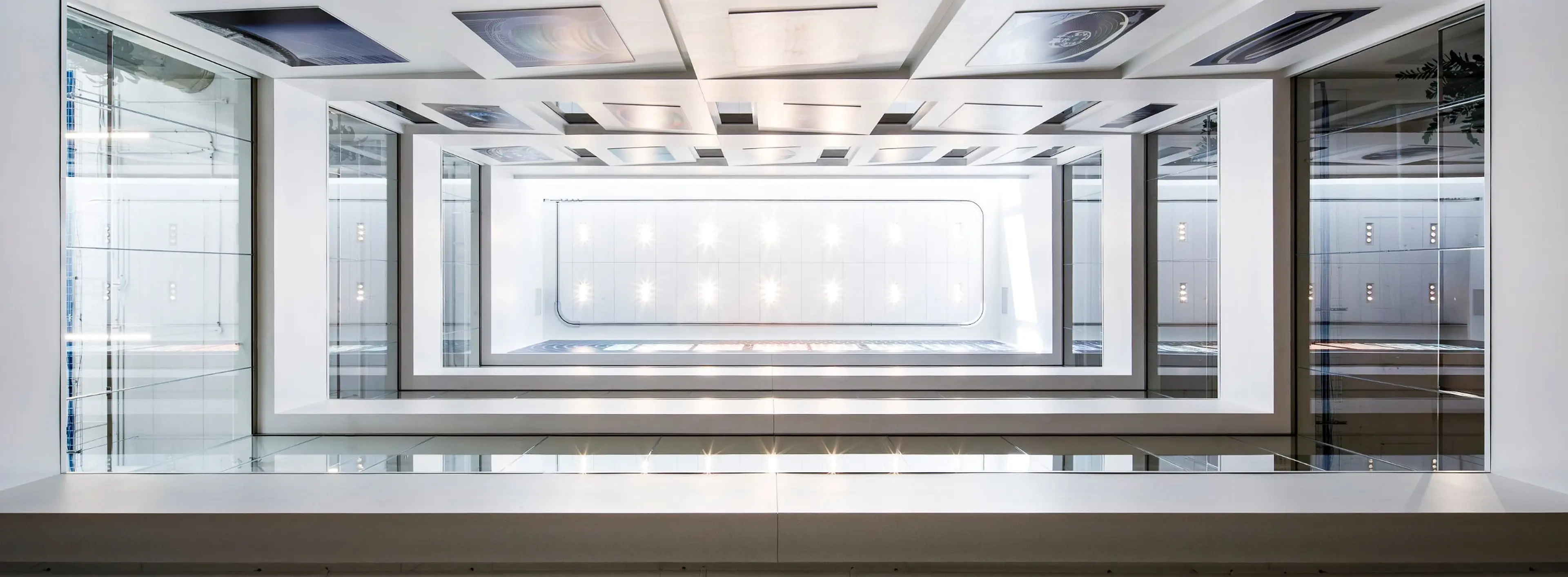 Bright, glass-walled atrium of ÉTS Pavilion F.
