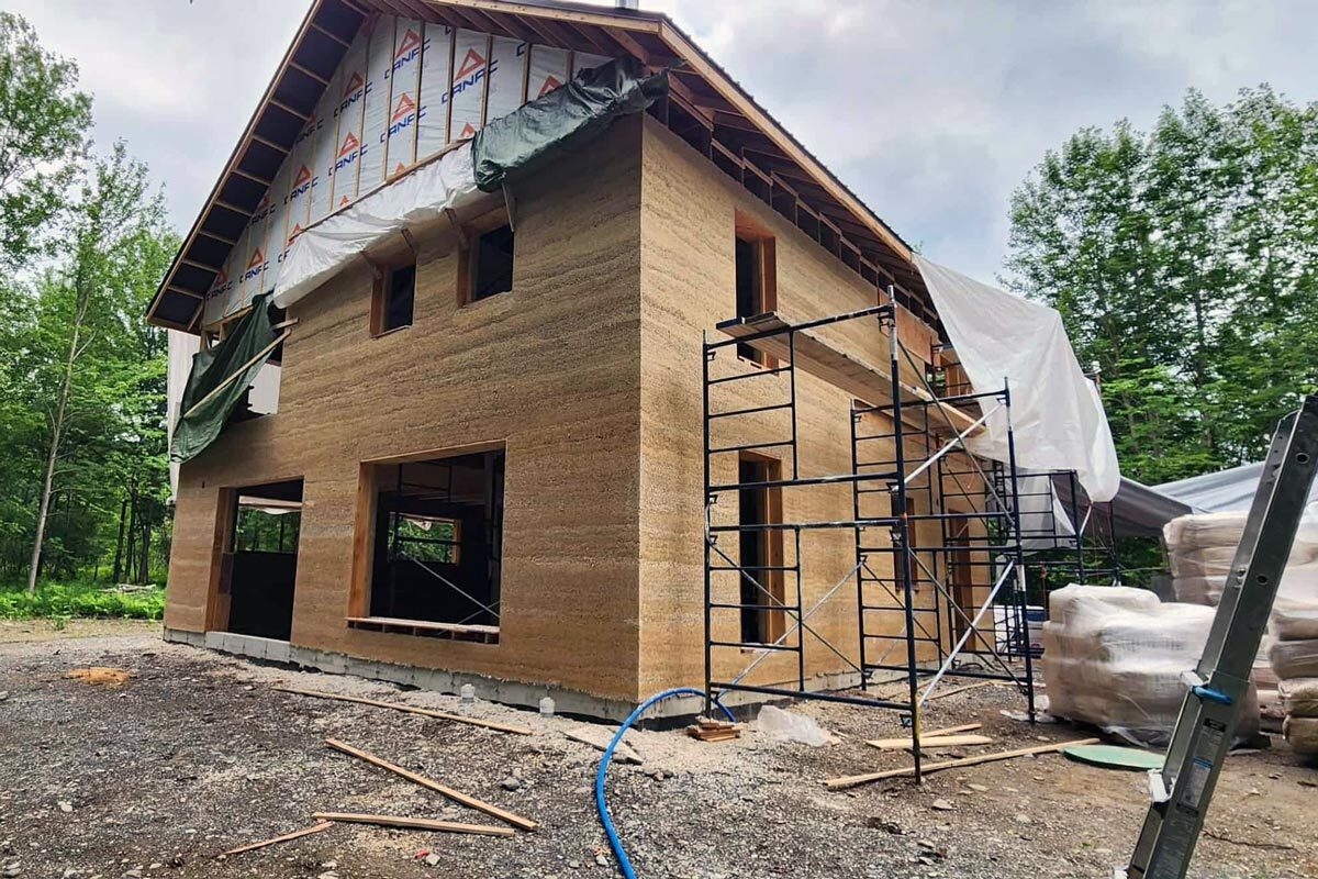 An example of a building constructed using interior cladding panels made from hemp-lime concrete and wood fibre.