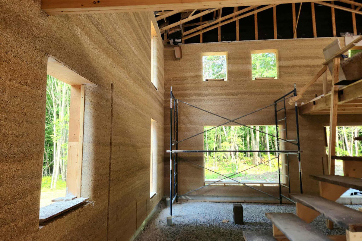 An example of a building constructed using interior cladding panels made from hemp-lime concrete and wood fibre.