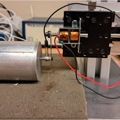 A close-up view of a setup featuring a motor connected to a control mechanism, showcasing advanced engineering components.