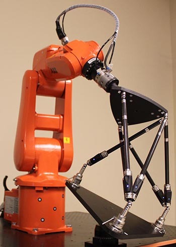 On peut se servir d'une barre télescopique Renishaw pour rendre les robots plus précis