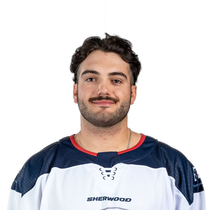 Étudiant en maillot sportif arbore fièrement les couleurs de son équipe d'hockey universitaire.
