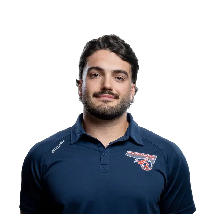 Étudiant en maillot sportif arbore fièrement les couleurs de son équipe d'hockey universitaire.