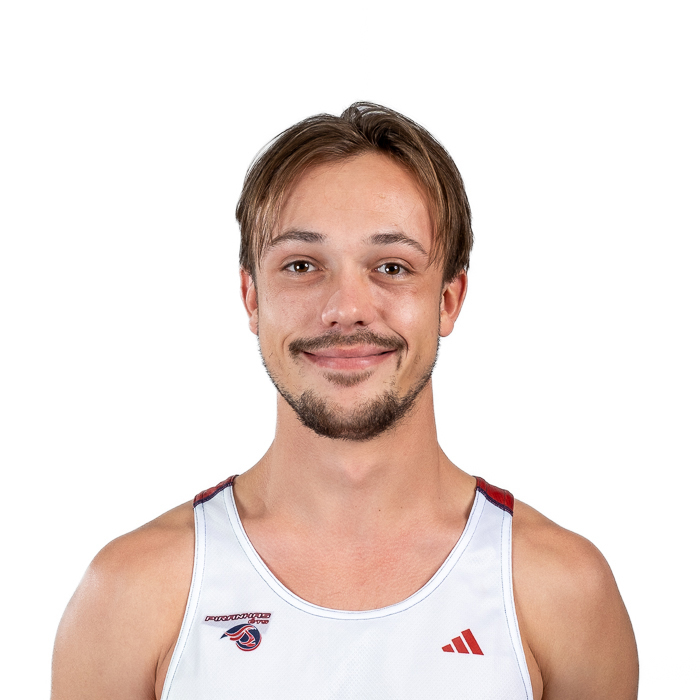 Étudiant en technologie supérieure, il affiche un sourire confiant, portant un maillot sport aux couleurs de l'université.
