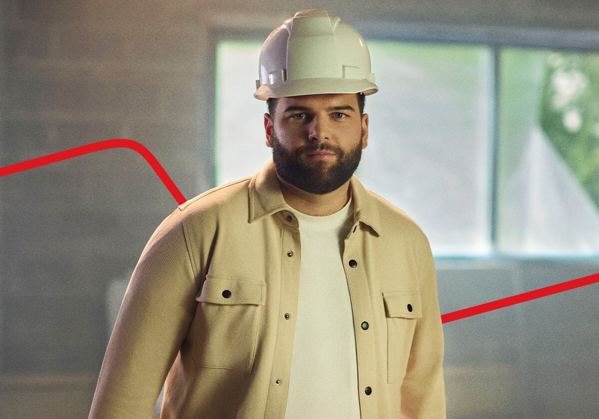 A young bearded man with a hard hat.