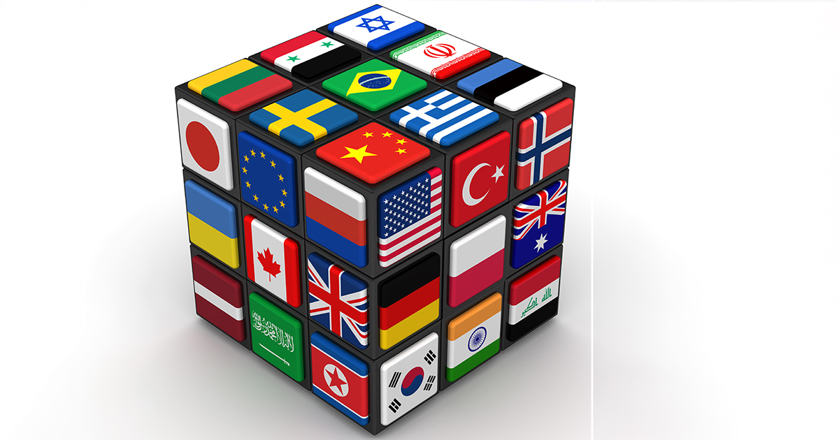 Un cube illustré avec des drapeaux de divers pays, symbolisant la diversité et l'internationalité dans l'apprentissage.