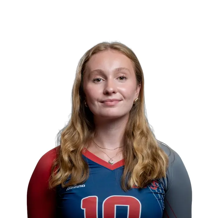 Athlète souriante en tenue de volleyball, arborant un maillot aux couleurs vibrantes, prête pour la compétition.
